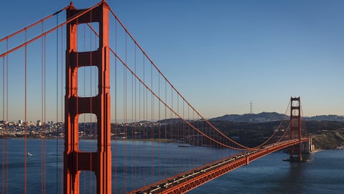 The Golden Gate Bridge is awash in warm light from the setting sun in San Francisco, California, February 13, 2015.