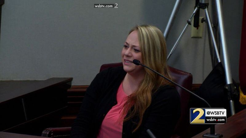 Leanna Taylor, the ex-wife of Justin Ross Harris, breaks down while testifying about how she learned that Cooper had died, during Harris' murder trial at the Glynn County Courthouse in Brunswick, Ga., on Monday, Oct. 31, 2016. (screen capture via WSB-TV)