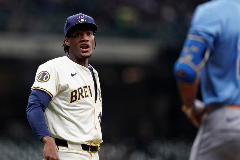 Milwaukee Brewers' Abner Uribe, left, and Tampa Bay Rays' Jose Siri exchange words during the eighth inning of a baseball game Tuesday, April 30, 2024, in Milwaukee. (AP Photo/Aaron Gash)