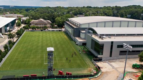 June 11, 2021 Athens - Aerial photo shows University of GeorgiaÕs Indoor Athletic Facility and new $80 million football operations building (right) on Friday, June 11, 2021. The UGAÕs athletic department simply is committed to too many other facility projects that have precedence at the moment. Most notable is the $80 million football operations building that has been added to the Butts-Mehre complex. (Hyosub Shin / Hyosub.Shin@ajc.com)