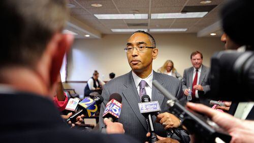 DeKalb County CEO Burrell Ellis responds to to the media after a hearing to determine if the charges against Ellis will interfere with his job running the state’s third-largest county, Monday, July 15, 2013, in Atlanta. David Tulis / AJC Special