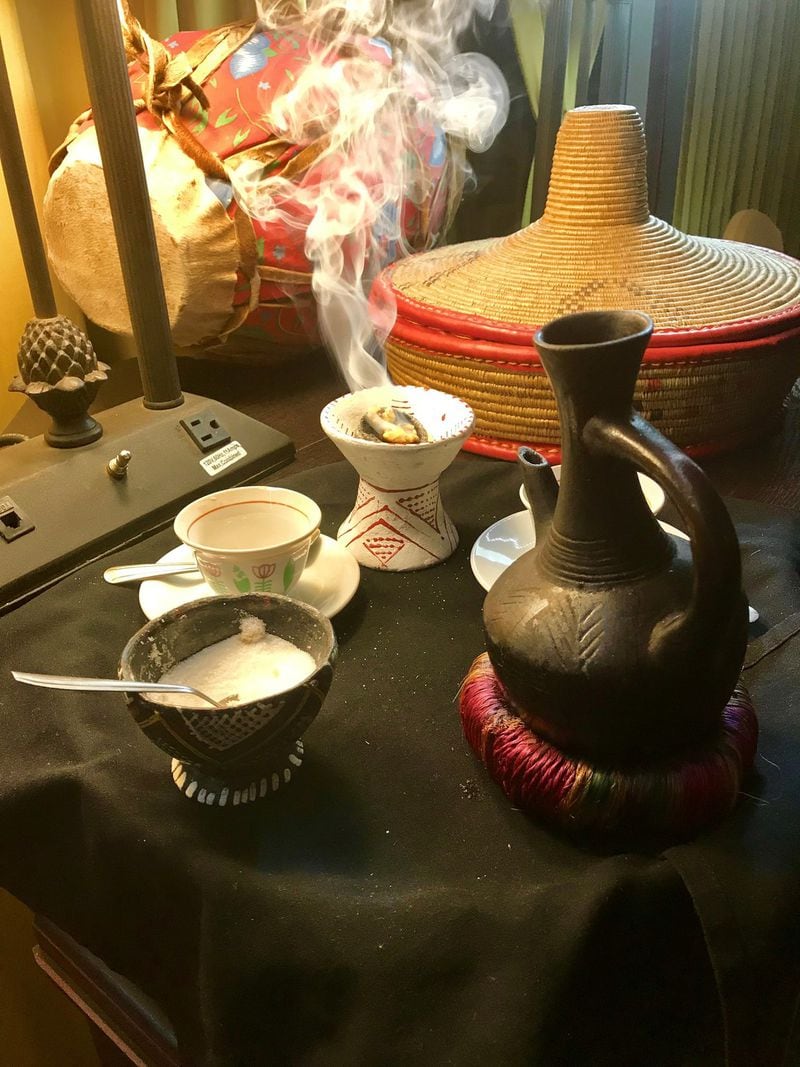 Coffee is an important part of Ethiopian culture. At Ghion Cultural Hall, an order of Buna coffee service for two brings a clay pot filled with freshly brewed, robust coffee as well as burning incense that lends a ceremonial element to the making and drinking of the coffee. LIGAYA FIGUERAS / LFIGUERAS@AJC.COM