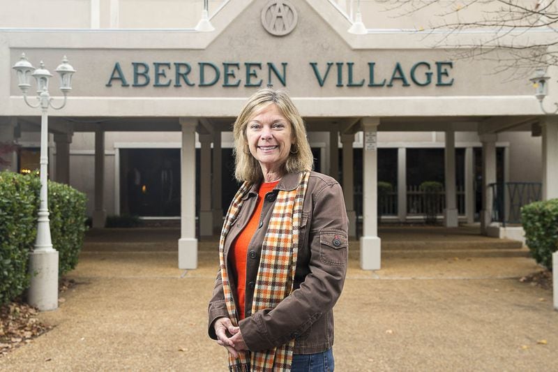 Kim Learnard sees Peachtree City adjusting to a new reality as land becomes more scarce for development. A former city councilwoman, Learnard stands in front of Aberdeen Village Center, one of a handful of shopping centers that anchor different village-like areas that stitch the planned community together. (ALYSSA POINTER/ALYSSA.POINTER@AJC.COM)