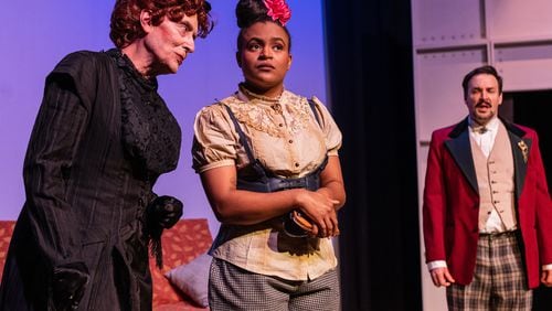 John Ammerman (from left), Tamia Fair and Phil Mann appear in the Aris Theatre production of Oscar Wilde's "The Importance of Being Earnest."