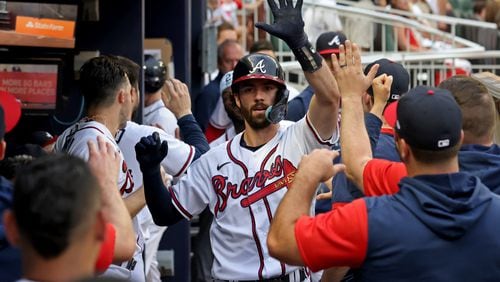 Braves shortstop Dansby Swanson celebrates his two-run home run with teammates during the third inning against the Los Angeles Dodgers at Truist Park Saturday, June 25, 2022, in Atlanta. (Jason Getz / Jason.Getz@ajc.com)