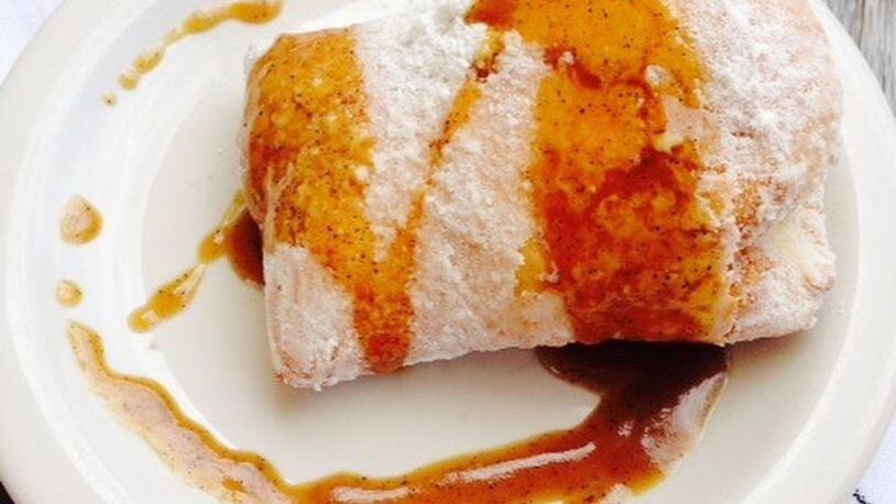 Watershed’s beignets are topped with sauce. (Green Olive Media)