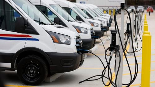 Several USPS vans are seen charging during the unveiling of the first of tens of thousands of electric vehicles and charging stations deployed nationally to power the country’s largest electric delivery fleet on Monday, January 22, 2024.
Miguel Martinez /miguel.martinezjimenez@ajc.com