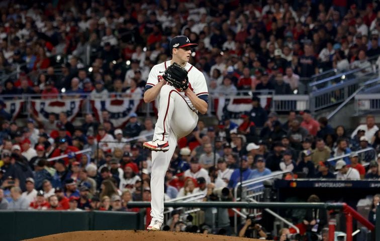 A standing room only crowd watches Atlanta Braves starting pitcher Kyle Wright (30) deliver to the Phillies during the second inning of game two of the National League Division Series baseball game at Truist Park in Atlanta on Wednesday, October 12, 2022. (Jason Getz / Jason.Getz@ajc.com)