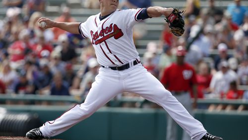 Atlanta Braves starting pitcher Kris Medlen (54) throws in the first inning of a spring exhibition baseball game against the Washington Nationals, Tuesday, March 4, 2014, in Kissimmee, Fla.