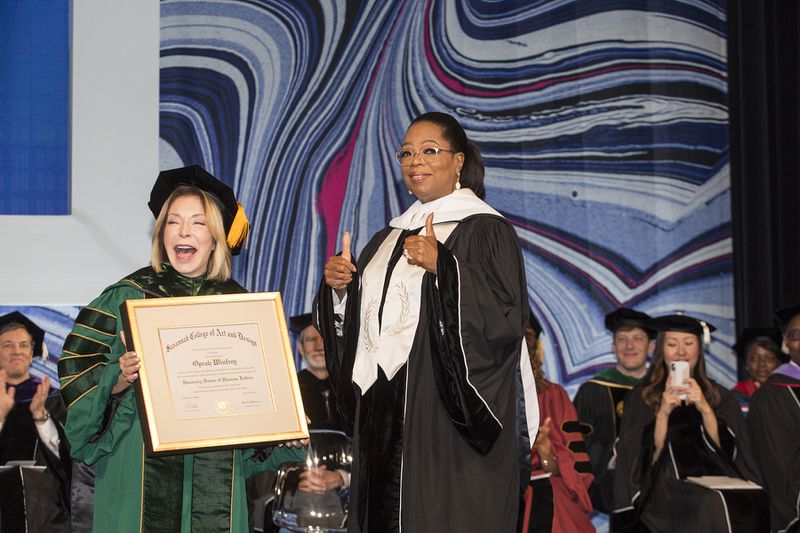 Oprah Winfrey receives an honorary degree from SCAD founder and president Paula Wallace at the Georgia World Congress Center June 2, 2018. Photography Courtesy of SCAD