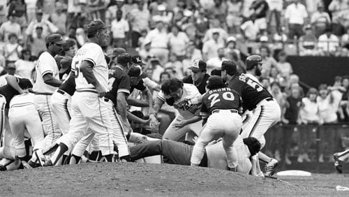 The Braves’ Braves Rick Mahler (center) is dragged away by the Padres’ Rich Gossage (right), Bobby Brown and others during an Aug. 12, 1984, brawl at Atlanta-Fulton County Stadium.
