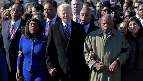 Vice President Joe Biden, center, leads a group across the Edmund Pettus Bridge in Selma, Ala., Sunday, March 3, 2013. They were commemorating the 48th anniversary of Bloody Sunday, when police officers beat marchers when they crossed the bridge on a march from Selma to Montgomery. From left: Selma Mayor George Evans, U.S. Rep. Terri Sewell, D-Ala., the Rev. Jesse Jackson, Biden, the Rev. Al Sharpton and U.S. Rep. John Lewis, D-Ga.