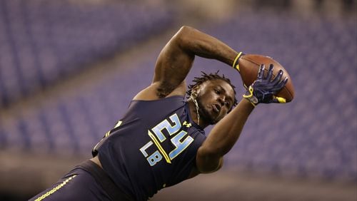Michigan linebacker Jabrill Peppers runs a drill at the NFL football scouting combine in Indianapolis, Monday, March 6, 2017. (AP Photo/Michael Conroy)