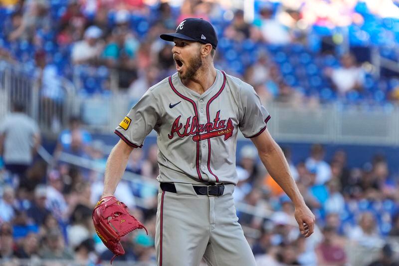 Atlanta Braves starting pitcher Chris Sale reacts after walking Miami Marlins' Jake Burger during the fifth inning of a baseball game, Saturday, April 13, 2024, in Miami. (AP Photo/Wilfredo Lee)