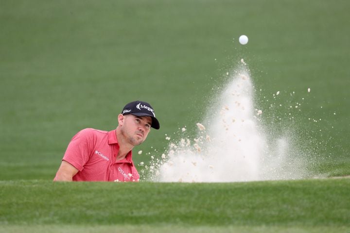 April 10, 2021, Augusta: Brian Harman hits out of the bunker on the second hole during the third round of the Masters at Augusta National Golf Club on Saturday, April 10, 2021, in Augusta. Curtis Compton/ccompton@ajc.com