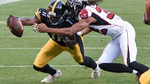 Pittsburgh Steelers wide receiver Justin Hunter (11), rleft, reaches the ball across the goal line for a touchdown as Atlanta Falcons cornerback Jalen Collins (32) defends after making a catch in the fourth quarterof an NFL preseason football game, Sunday, Aug. 20, 2017, in Pittsburgh. (AP Photo/Don Wright)