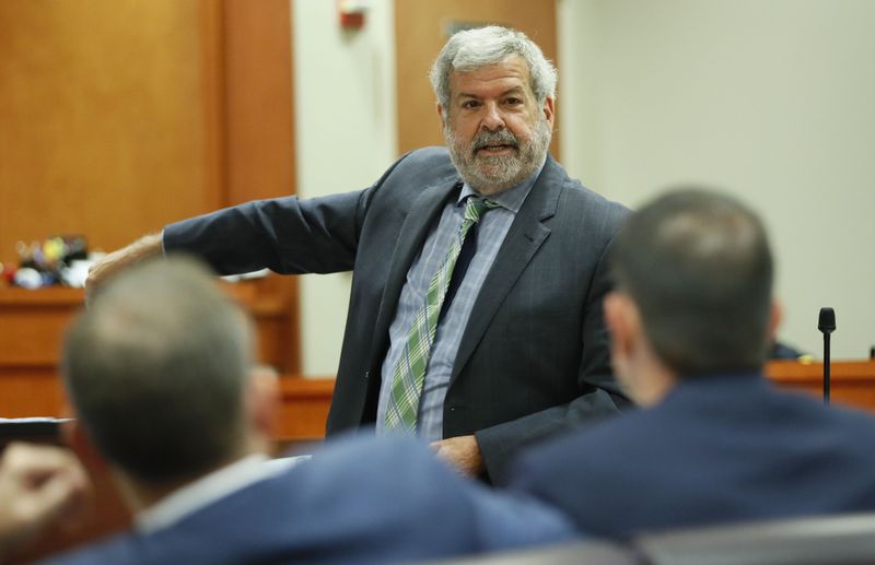 October 2, 2019 - Decatur - Defense attorney Don Samuel looks toward prosecutors during a court discussion with Judge LaTisha Dear Jackson over a prosecution objection raised during Samuel's cross-examination of DeKalb Police Sgt. J.K. Walker.  Former DeKalb County police officer Robert "Chip" Olsen is on trial for murder in the 2015 shooting of mentally ill war veteran Anthony Hill.  Bob Andres / robert.andres@ajc.com