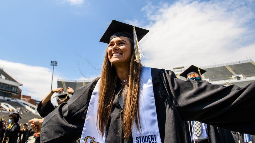 Georgia Tech softball player Cameron Stanford celebrates graduation in May 2021 at Bobby Dodd Stadium. Stanford was a three-time All-ACC outfielder and a two-time member of the All-ACC academic team and earned her degree in mechanical engineering. (Danny Karnik/Georgia Tech Athletics)