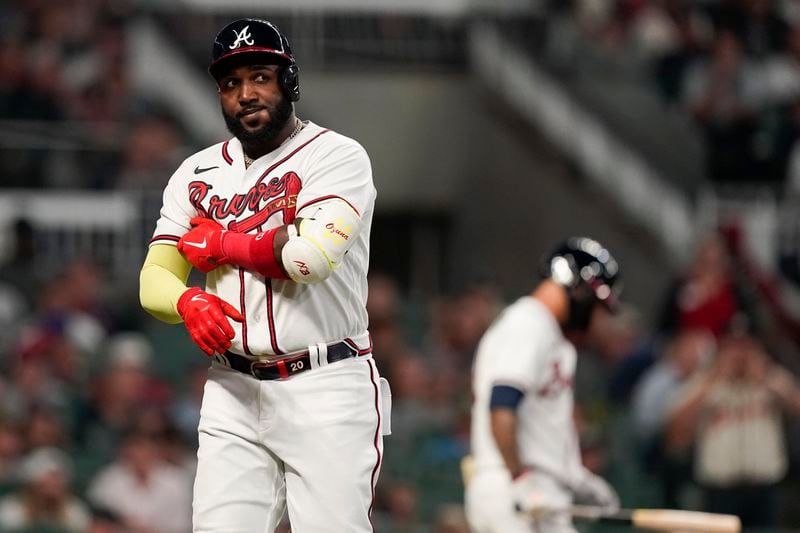 Braves designated hitter Marcell Ozuna (20) reacts to being struck out by Philadelphia Phillies starting pitcher Zack Wheeler during the sixth inning in Game 2 of baseball's National League Division Series, Wednesday, Oct. 12, 2022, in Atlanta. (AP Photo/Brynn Anderson)