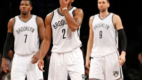 Brooklyn Nets forward Joe Johnson (7) guard Jarrett Jack (2) and Nets center Andrea Bargnani (9) react in the second half of their 103-96 loss to the Milwaukee Bucks in an NBA basketball game, Monday, Nov. 2, 2015, in New York. (AP Photo/Kathy Willens)