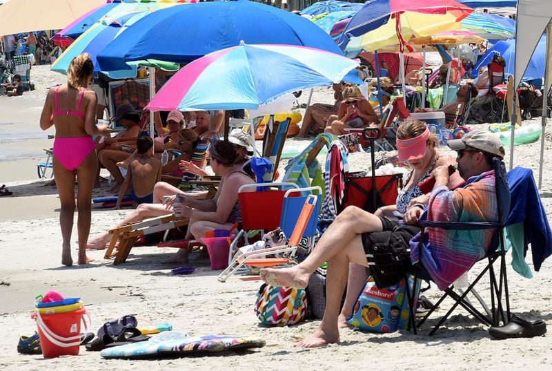 East Beach in Brunswick was packed with people on July 14, 2020. Glynn County — home to Georgia's popular beach getaways of Jekyll, Sea and St. Simons islands — has become a major hotspot for the coronavirus disease, according to an Atlanta Journal-Constitution analysis of state health data. (RYON HORNE / RHORNE@AJC.COM