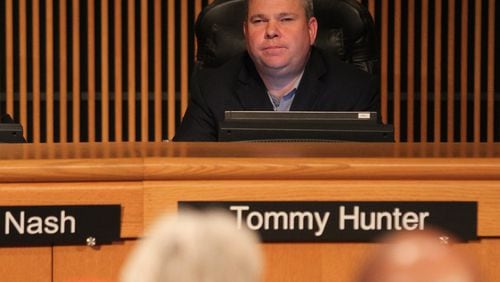 January 17, 2017, Atlanta — Gwinnett County Commissioner Tommy Hunter listens to Gwinnett residents who turned out Tuesday to rail against the “racist pig” comment that Hunter posted on Facebook about John Lewis. (Henry Taylor/ henry.taylor@ajc.com)