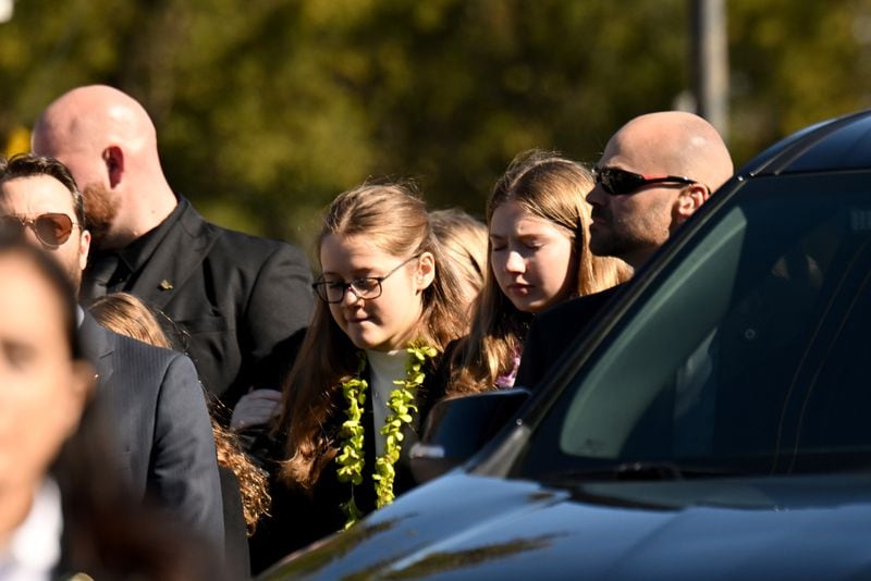 Carter family members follow the hearse after the funeral for Rosalynn Carter. A private interment followed at the Carter residence, Wednesday, November 29, 2023, in Plains. (Hyosub Shin / Hyosub.Shin@ajc.com)