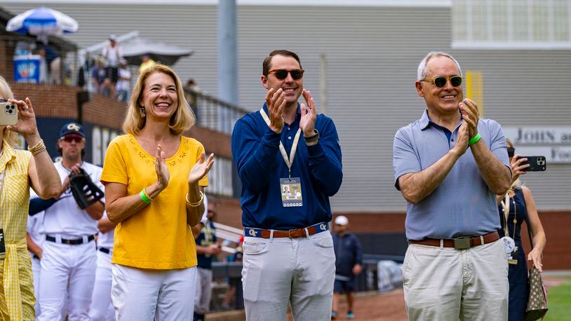 Georgia Tech athletic director J Batt is flanked by Tech president Angel Cabrera, right, and his wife, Beth Cabrera, as they watch the ceremony honoring Tech baseball great Mark Teixeira. Tech retired Teixeira's jersey No. 23 before the Yellow Jackets played Virginia on Saturday, May 20, 2023 at Russ Chandler Stadium. (Photo by Eldon Lindsay/Georgia Tech Athletics)