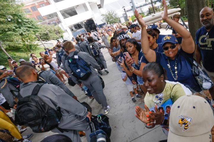 Fans cheer the Georgia Tech football team as they arrive at the stadium.    (Bob Andres for the Atlanta Journal Constitution)