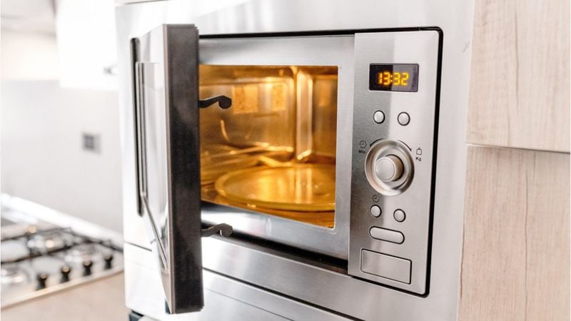 If there's a removable part like a microwave turntable, take it out, remove food debris and wash with hot, soapy water. Don’t return it to the appliance until it's dry. (Dayton Daily News)