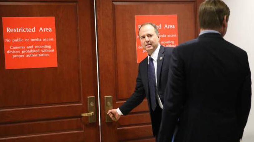 Rep. Adam Schiff (L) (D-CA), ranking member of the House Permanent Select Committee on Intelligence, arrives for a committee meeting at the U.S. Capitol February 5, 2018 in Washington, DC.