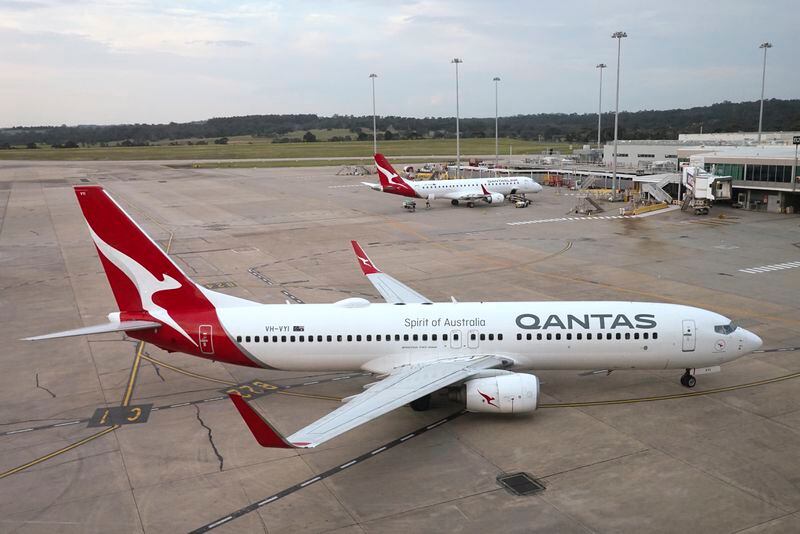 FILE - A Qantas jet arrives at Melbourne's Tullamarine Airport in Melbourne, Australia, Dec. 12, 2023. Qantas Airways agreed to pay 120 million Australian dollars ($79 million) in compensation and fines for selling tickets on thousands of cancelled flights, the airline and Australia’s consumer watchdog said on Monday, May 6, 2024. (AP Photo/Mark Baker, File)