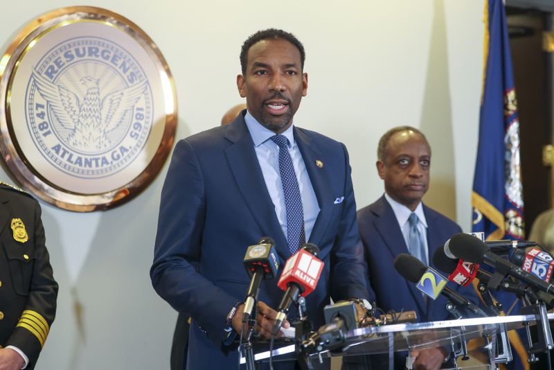 Atlanta Mayor Andre Dickens speaks to the media next to Dekalb County CEO Michael Thurmond, right, during a press conference about the planned Atlanta Public Safety Training Center at Atlanta City Hall, Tuesday, January 31, 2023, in Atlanta. Jason Getz / Jason.Getz@ajc.com)
