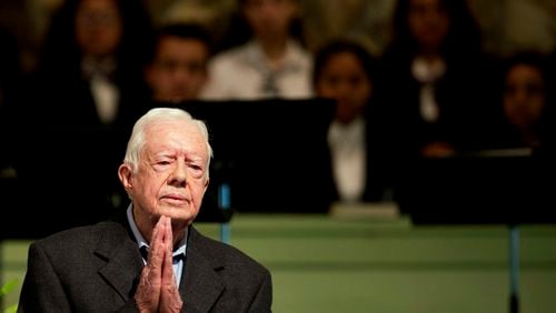 FOR USE AS DESIRED, YEAR END PHOTOS - FILE - Former President Jimmy Carter teaches Sunday School class at Maranatha Baptist Church in his hometown Sunday, Aug. 23, 2015, in Plains, Ga. The 90-year-old Carter gave one lesson to about 300 people filling the small Baptist church that he and his wife, Rosalynn, attend. It was Carter’s first lesson since detailing the intravenous drug doses and radiation treatment planned to treat melanoma found in his brain after surgery to remove a tumor from his liver. (AP Photo/David Goldman, File)