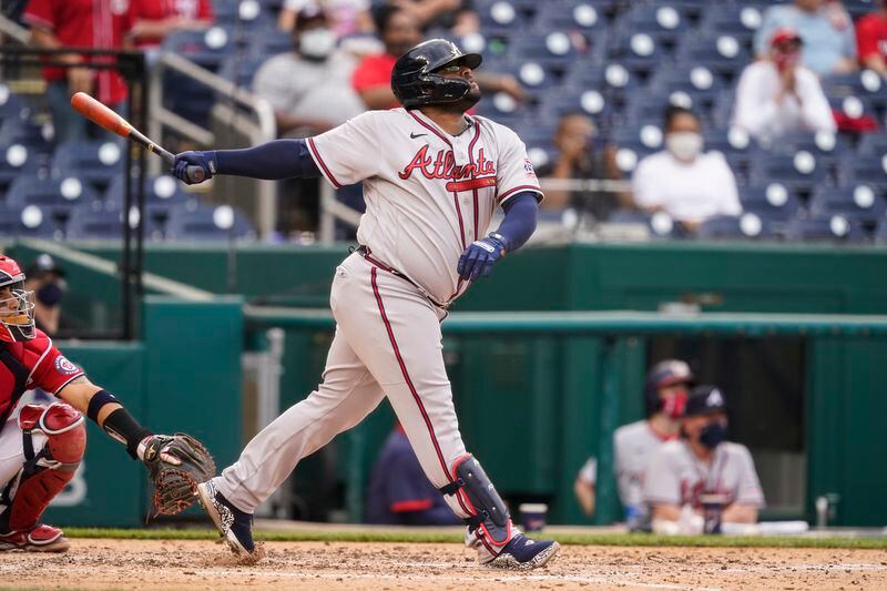 Atlanta Braves' Pablo Sandoval watches his two-run homer during the seventh inning of the second baseball game of a doubleheader against the Washington Nationals, at Nationals Park, Wednesday, April 7, 2021, in Washington.The Braves won the second game 2-0. (AP Photo/Alex Brandon)