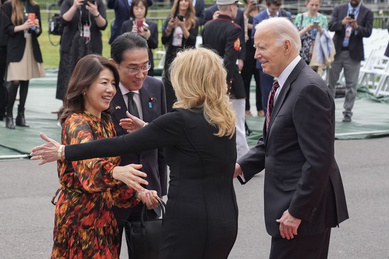 President Joe Biden (far right) and first lady Jill Biden greet Japanese Prime Minister Fumio Kishida (second from the left) and his wife Yuko Kishida (far left) upon their arrival at the White House on Tuesday.