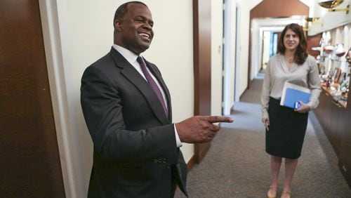Former Mayor Kasim Reed (left) and his then-press secretary, Jenna Garland (right), in 2015. Garland’s text messages instructing another city employee to delay an open records are the subject of a GBI criminal investigation. JOHN SPINK / JSPINK@AJC.COM