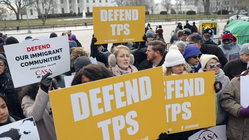 Opponents of the government’s decision to cancel “temporary protective status” for more than 200,000 El Salvadorans in the U.S. demonstrate across from the White House on Monday. (AP Photo/Pablo Martinez Monsivais)