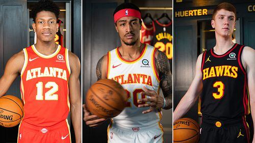 Hawks' De'Andre Hunter (from left), John Collins and Kevin Huerter model the new uniform styles that will make their debut in the 2020-21 NBA season.
