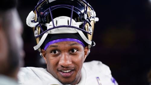 Washington quarterback Michael Penix Jr. is interviewed after the team's win over Southern California in an NCAA college football game, Saturday, Nov. 4, 2023, in Los Angeles. (AP Photo/Ryan Sun)