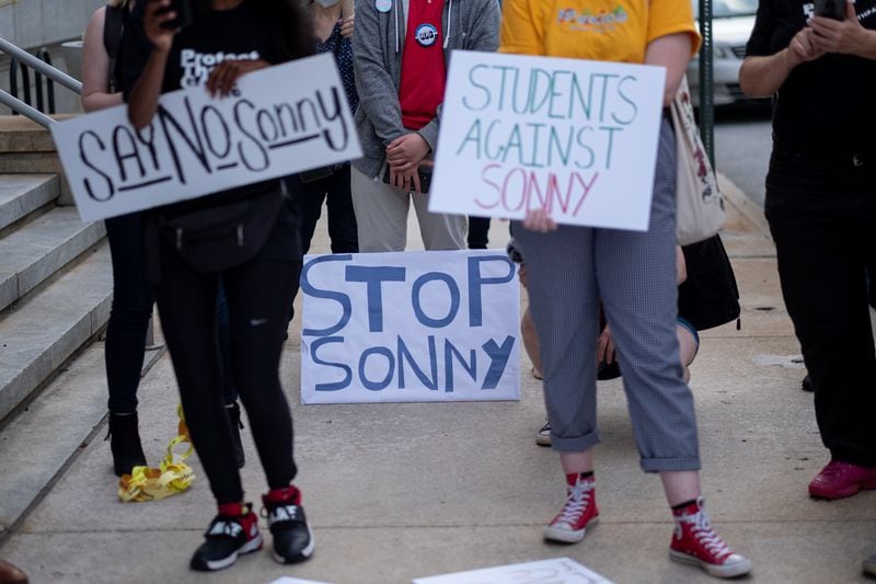 Students gather in front of the University System of Georgia offices in downtown Atlanta on Tuesday, April 27, 2021, to protest against Sonny Perdue becoming the new chancellor. (Ben Gray for The Atlanta Journal-Constitution)