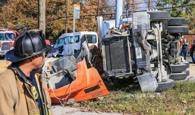 Five people were injured Monday in a crash involving a tractor-trailer and a van, authorities said. JOHN SPINK / JSPINK@AJC.COM