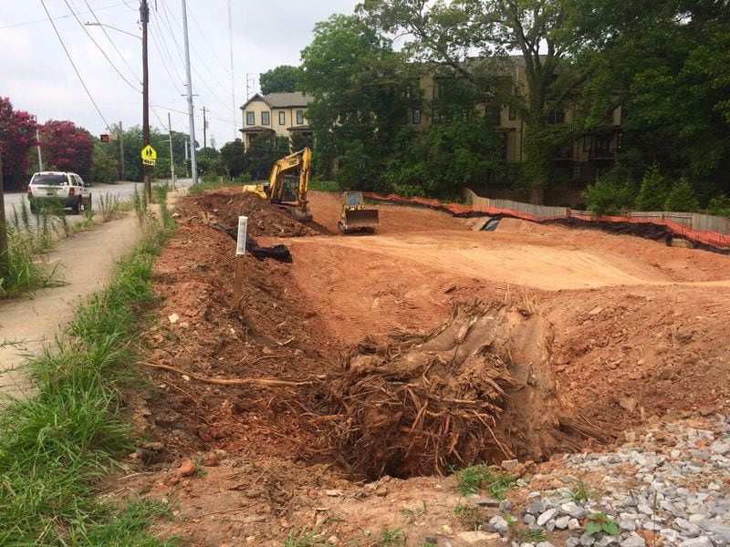 Areas of land along DeKalb Avenue are now seen as prime sites for townhome living. This construction site is up the road from the latest tree-cutting controversy. (Photo by Bill Torpy)