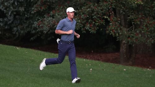 Andy Ogletree runs down the 11th fairway during the second round of the Masters on Friday at Augusta National. (Curtis Compton / Curtis.Compton@ajc.com)