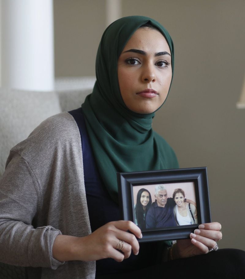 August 13, 2019, 2019 - Peachtree Corners - Mariam Slaibi holds a photo of her father. The Slaibi family lost their father to cancer last year. Now with the sterigenics plant, they wonder if there could be a connection. Bob Andres / robert.andres@ajc.com