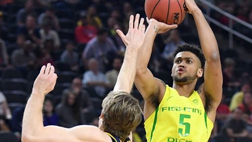 Tyler Dorsey of the Oregon Ducks shoots against Grant Mullins of the California Golden Bears during a semifinal game of the Pac-12 Basketball Tournament at T-Mobile Arena on March 10, 2017 in Las Vegas, Nevada. Oregon won 73-65. (Photo by Ethan Miller/Getty Images)