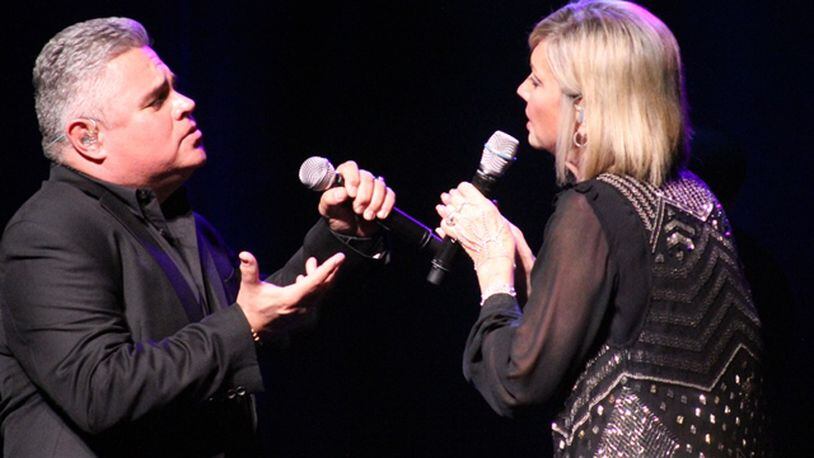 Olivia Newton-John and backup singer Steve Real duet on "Suddenly." The singer performed at Cobb Energy Performing Arts Centre Sunday night, her first Atlanta visit since 2009. Photo: Melissa Ruggieri/AJC