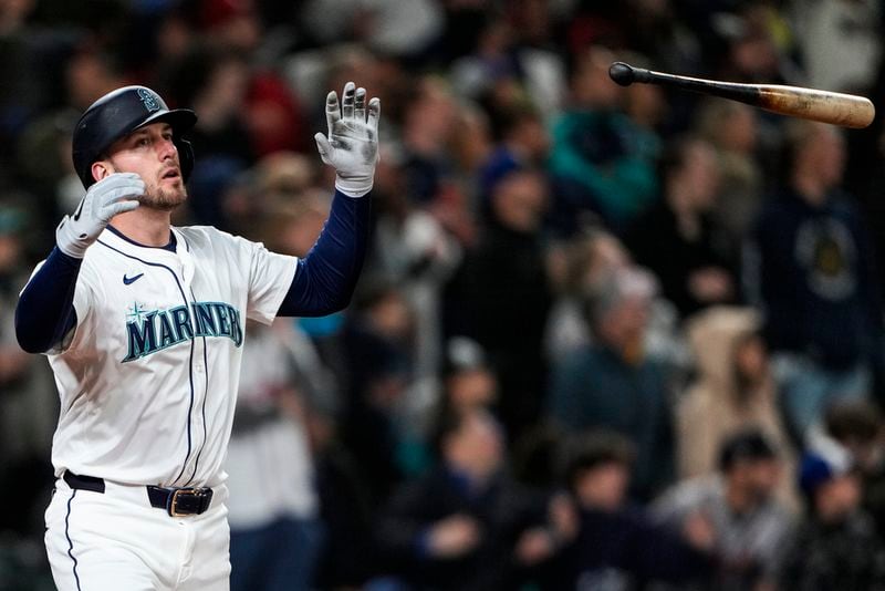 Seattle Mariners designated hitter Mitch Garver flips his bat after hitting a two-run walk-off home run against the Atlanta Braves during the ninth inning of a baseball game Monday, April 29, 2024, in Seattle. The Mariners won 2-1. (AP Photo/Lindsey Wasson)