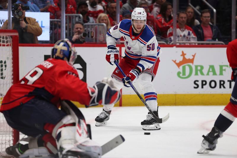 New York Rangers left wing Will Cuylle (50) shoots during the second period in Game 4 of an NHL hockey Stanley Cup first-round playoff series against the Washington Capitals, Sunday, April 28, 2024, in Washington. (AP Photo/Tom Brenner)