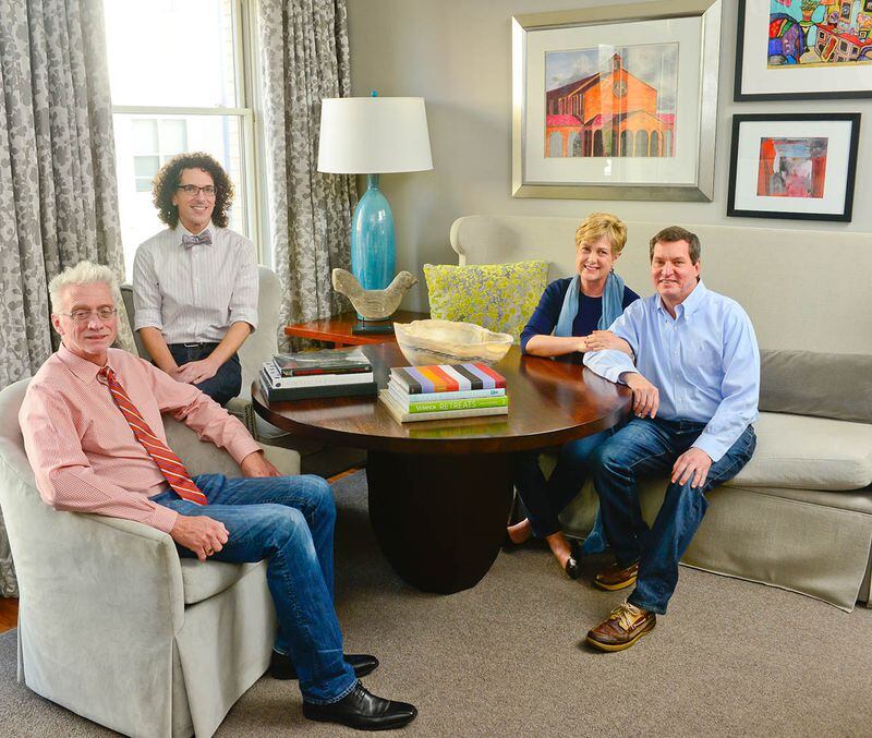 Paul and Tricia Dusseault (right) bought their condo at the Artisan in Decatur in 2008 and upgraded it in 2013 with the help of Robert Grayson (far left) and Andrew Harris of GraysonHarris Interiors + Design.